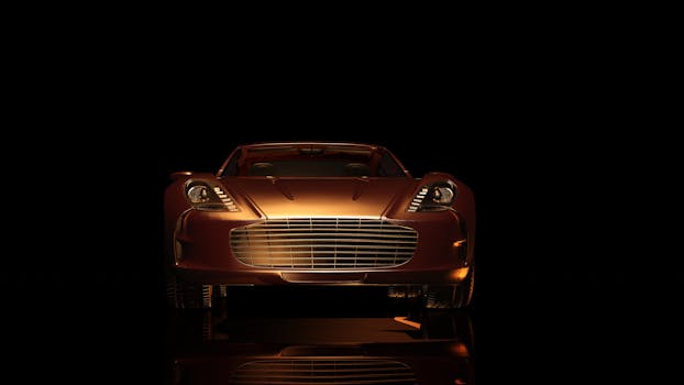 Front view of a luxurious sports car in a dark setting, showcasing elegance and design.